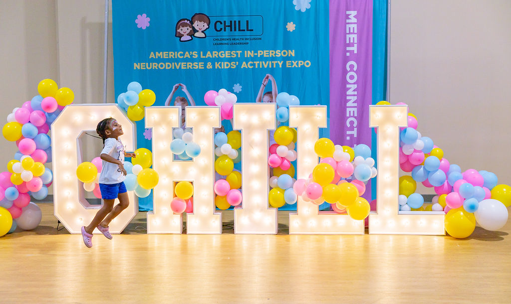A child enjoying the colorful CHILL ACT event display in San Antonio
